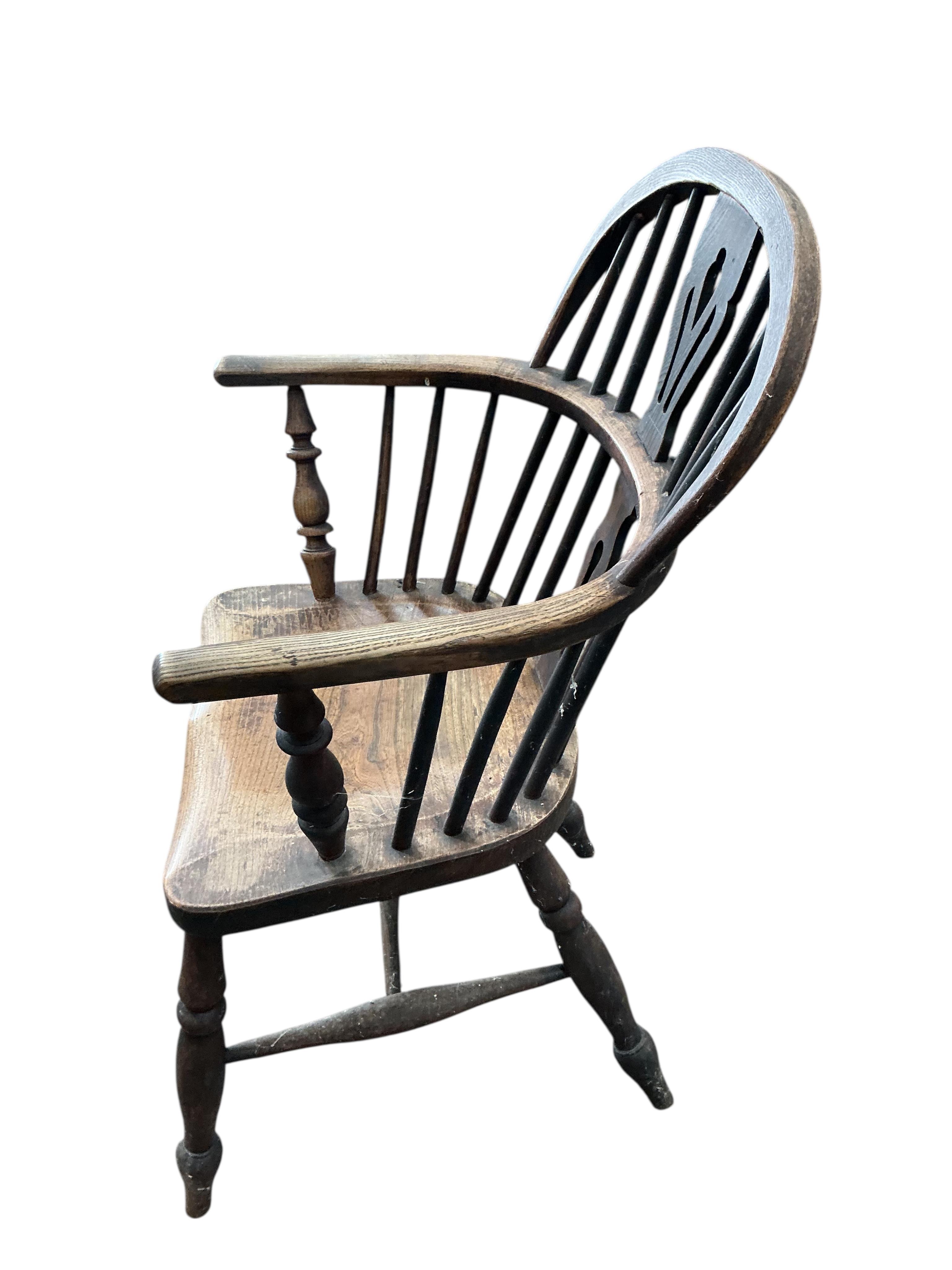 A mid 19th century ash and elm Windsor elbow chair, width 56cm, depth 37cm, height 91cm